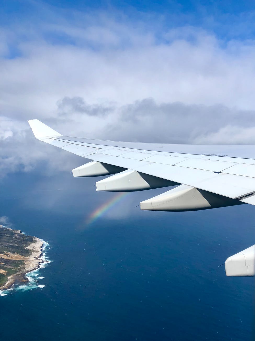 airplane wing with rainbow
